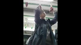 Funny Tired guy sleeping while standing up on subway