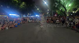 Like a human slinky! Woman able to spin dozens of metal hoops on her body