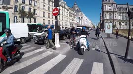 (GoPro) Motor Scooters (including a CityScoot) driving on the brand new bicycle lane of Rivoli street (Paris) inaugurated by the Mayor Hidalgo. Even the press talks about these road offenses
