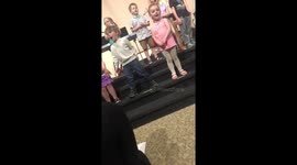 Kid acting silly during performance