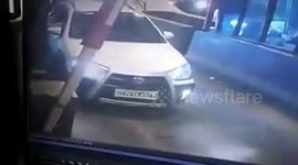 Shocking moment a man comes out of his car brandishing a gun at a toll plaza