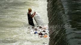 Plastic collected out of river by man in Indonesia