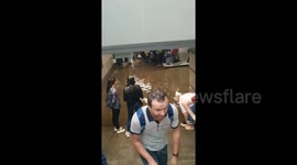 Russian commuters wade through flooded station in Moscow