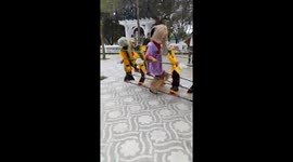 The man controls puppets around him dancing to music