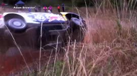 rally car nearly rolls over