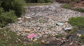 River Jordan polluted by plastic rubbish left by campers