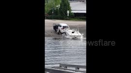Canada man nearly ran over by his own truck as it plunges into river