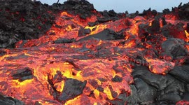 Mesmeric lava appears to flow in slow-motion on Hawaii mountain