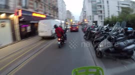 (GoPro dashcam) A scooterist slaps the head of his passenger then drive in wrong way, moreover in a bicycle lane. Paris. 16 may 2019