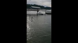 Boater and vehicle in water