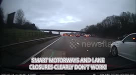 Smart Motorway is not so smart! M25 Stranded vehicle, lane closed. BMW driver ignores it until he reaches the cones and stranded vehicle.
