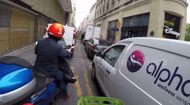 (GoPro)Scooters driving on the sidewalks in Paris to avoid the traffic jams . (Paris Hotel de Ville+Champs Elysees).17 may 2019.