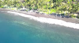 2.7K Drone Aerial panning View of the Waves & Coastline Bali's Tulamben Beach