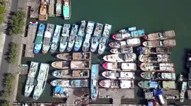 2.7K Aerial View from Above of Wooden Fishing Boats Docking at the Bali Harbour