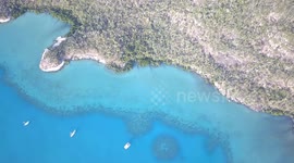 Stunning Aerial view from above at Nara Inlet Reef with Sailboats and Catamarans