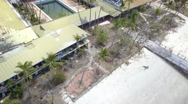 Aerial View from above Abandoned South Molle Resort Beach with of Main Building