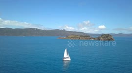 2.7K Slow Panning Aerial View Of Sailing Catamaran at the Whitsunday Islands