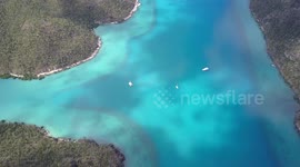 2.7K Aerial View of the Nara Inlet anchorage with Sailboats & Catamarans
