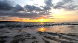 4K Waves Bali Beach with traditional Fishing Boats During Sunset Slow Motion