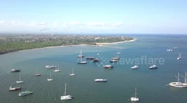 2.7k Aerial View of Sail- Yacht Boats & flying Kites Sanur Beach Bali Indonesia