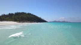 2.7K Aerial View flying above Waves at Whitehaven Beach Whitsunday Islands