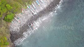 2.7k Aerial View from Above of traditional Jukung fishing boats & Coastline in Amed Bali