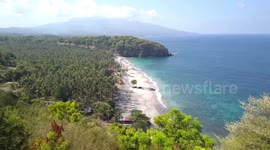 2.7K Drone Aerial View towards Virgin Secret Beach through Trees Bali Indonesia