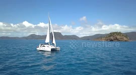 2.7K Panning Aerial View Of Sailing Catamaran Boat at the Whitsunday Islands