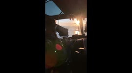 Helicopter aerobatics seen from camera helicopter