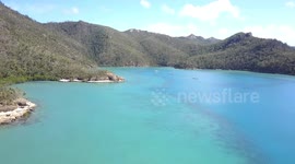 Stunning Aerial flight towards Sailboats & Catamarans Nara Inlet Reef anchorage