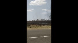 Black dust devil sucks up farmland