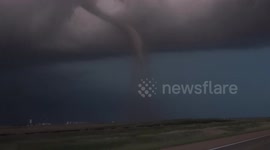 Kansas twister causes semi-truck to flip onto its side