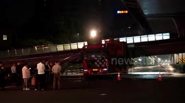 Car luckily escapes being flattened after lorry brings down footbridge in China