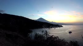 4K sunset timelapse at Amed Bay and Mount Agung Volcano in Bali, Indonesia