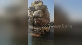 Ridiculously overpacked truck driven on road in Egypt