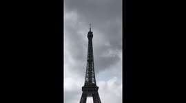Man Climbs Up Side of Eiffel Tower
