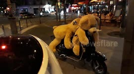 Teddies bear of the Gobelins spotted on a scooter. Paris. 20 may 2019