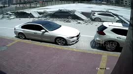 Wall collapses and damages 13 parked cars in China's Guangdong