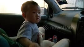 Baby afraid of Automatic Car Washing Machine