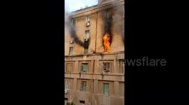 Man escapes Rome apartment fire by clinging onto outside of building