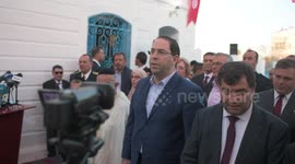 Tunisian Prime Minister Youssef Chahed sings the Tunisian National Anthemat the Lag B’Omer festival in the Synagogue on the Tunisian resort island of Djerba on May 22, 2018, the first day of the religious festival