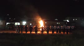 Hasidic Jews dance around bonfire during celebration of Lag B'omer in Meron