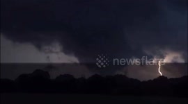 Terrifying night-tornado illuminated by streaks of lightning in Oklahoma, USA
