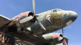 Just a plane coffee please! Thai cafe has WWII aircraft ON ROOF