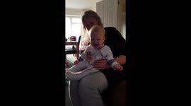 Baby loves throwing wrapping paper