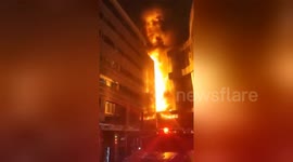 Firefighters on the scene as a mall in China goes up in flames