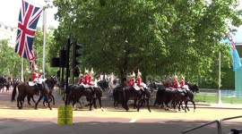 Trooping the Colour reviewed by The Major General - Household Cavalry and Mounted Brass Band enter the Horse Guards Parade from The Mall