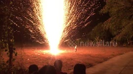 Brilliant 'golden shower' firework blazes at Thai temple celebration