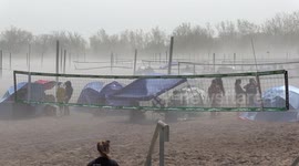 Wind blows heavy fog onto Toronto beach creating near zero visibility for a time at a youth volleyball tournament