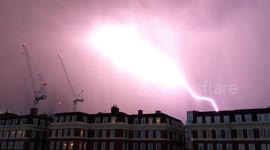 Moment lightning appears to strike plane over stormy London skies